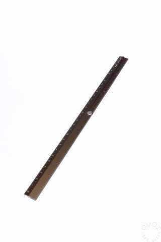Brown aluminum multi ruler with printed measurement markings along the edge