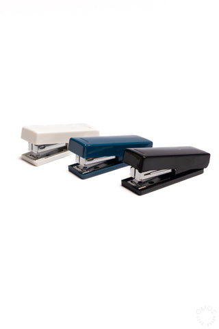 Compact XS staplers in white, blue, and black with open base