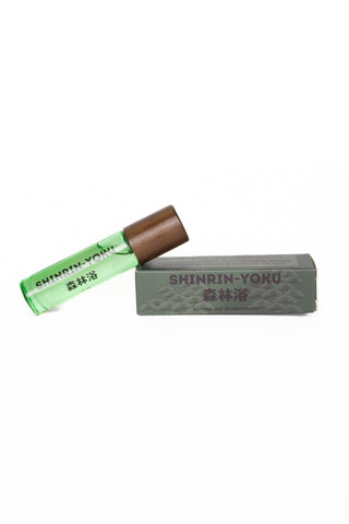 Green skin scent tube with brown cap and gray Shinrin-Yoku bar