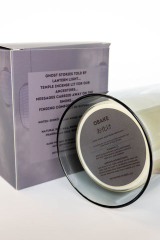 Obake candle jar with printed lid and cream wax visible at the rim
