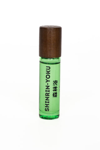 Green skin scent roller bottle with dark brown cap