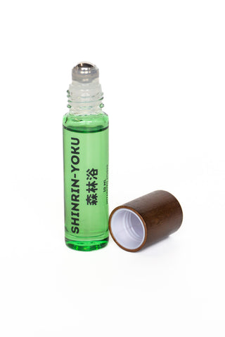 Green skin scent bottle with brown cap, open white inner rim