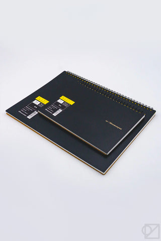 Black A5 blank spiral notebook pair with gold wire binding and cover labels