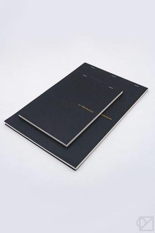 Black grid notepad with twin elastic page markers and stitched cover