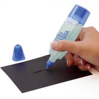 Tombow Mono Aqua liquid glue pen with blue tip dispensing glue