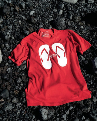 Red T-shirt with large white tongue-and-mouth graphic print
