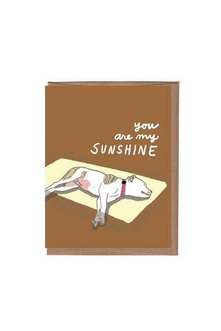 Brown greeting card with dog illustration and script text "You are my Sunshine".