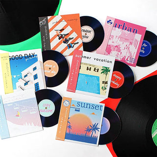 Assorted record message cards with colorful covers and black vinyl discs