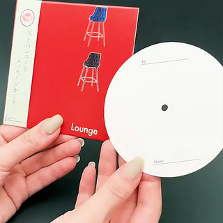 Red record message card with blue and black stool art, 'Lounge' text, and white circle tag