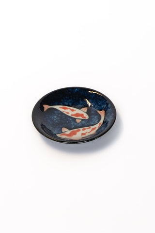 Round dark blue sauce dish with koi fish design, glossy finish