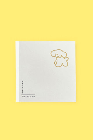 Square notepad with blank pages and gold line-dog illustration on white cover