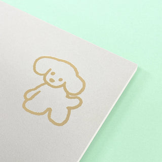 Square notepad cover with large gold fluffy dog outline, clean minimal design