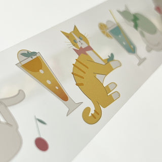 Curing tape closeup with yellow cat holding drink and blue bottle icons