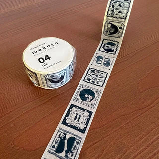 Cat tile washi tape laid across tabletop, blue and white pattern