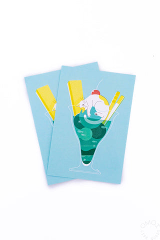 Light blue postcard set with cute cartoon girl illustration in green and yellow