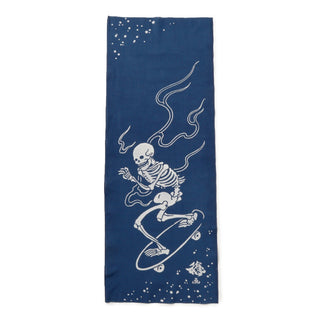 Navy tenugui towel with white skeleton, skateboarding, and wave line art