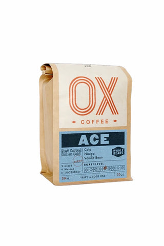 Whole bean coffee bag by OX Coffee, ACE blend, kraft paper pouch with orange logo