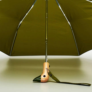 Olive compact umbrella open showing ribs, center pole, and duck handle