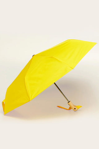 Yellow compact umbrella opened with duck handle and visible metal frame