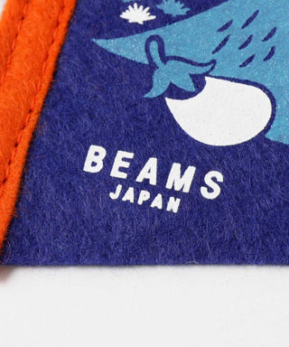 Blue pennant close-up with BEAMS JAPAN lettering and mountain-style graphic.