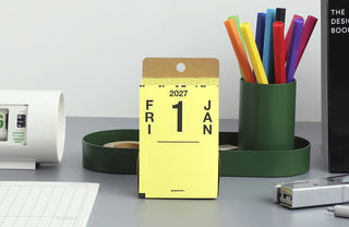 Yellow 2027 calendar block with bold month layout and top hanging hole