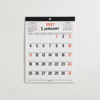 January 2027 wall board calendar page with numbered dates in black and orange accents.