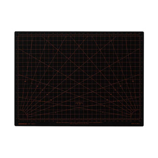 Black A4 cutting mat with measurement grid and orange angle lines.