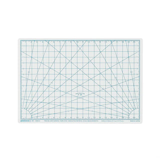 White A5 cutting mat with ruler markings and angle grid