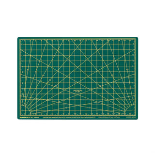 Green A5 cutting mat with diagonal grid and inch marks