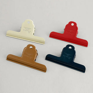 Assorted steel binder clips in multiple colors, including navy