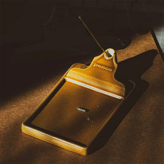Brown ceramic incense holder with incense stick and rectangular ash tray