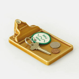 Brown ceramic incense holder tray holding keyring, coin, and incense stick holder
