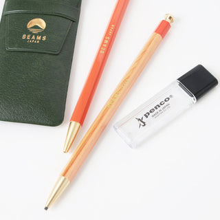 Natural and orange mechanical pencils with black leads; PENCO eraser case