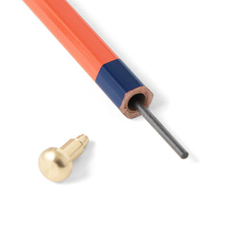 Orange and blue mechanical pencil tip with exposed graphite lead and metal point