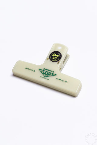 Cream plastic binder clip with clamp arm