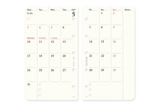 Monthly schedule refill open spread with weekday columns, red highlights, and memo section.