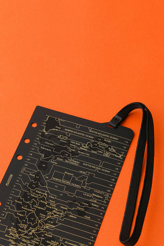 Bible-size notebook cover with gold route chart and attached elastic band, black