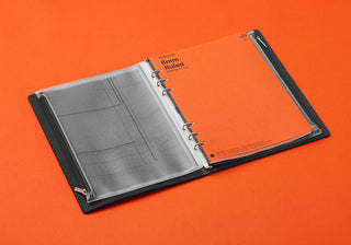 PLOTTER A5 fastener case open with gray grid inserts and metal rings on binder