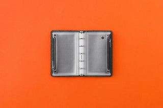 Fastener case mini-5, open with two gray mesh pages and central hinge