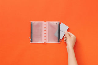 Mini fastener case open with side clip and paper card inserted