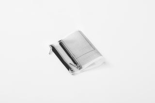 Gray mini fastener case with two mesh panels and metal latch, flat lay