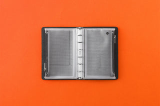 White mini fastener case open with two mesh panels and snap closure sides