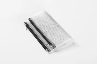 Narrow fastener case with white-gray mesh panel and black spine, angled view