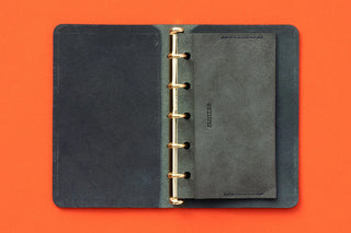 Open leather card case mini with brass binder rings and dark gray inner pages
