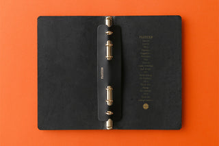 Black leather narrow Bible ring supporter with two metal rings, open binder view