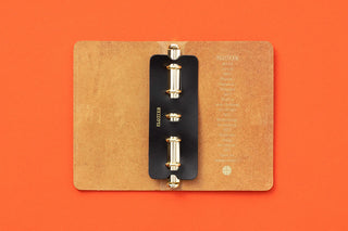 Tan leather mini-5 ring supporter with black binder rings and metal posts