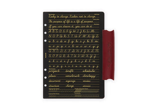 Red-brown leather binder with black insert card showing alphabet and lines