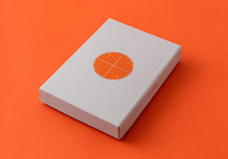 Red-brown leather binder mini-5 gift box with circular orange logo on the lid