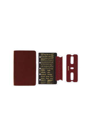Mini-5 leather binder components: red-brown cover, text card, and spine strip