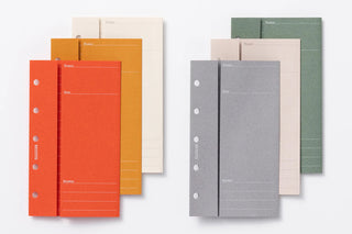 Set of mini-5 size project manager notebooks in assorted colors, each with hole strip